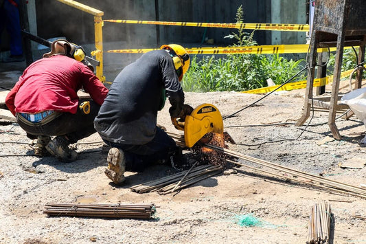 Construction workers tend to be male and are at higher risk of hearing loss so they are wearing headphones to protect their hearing