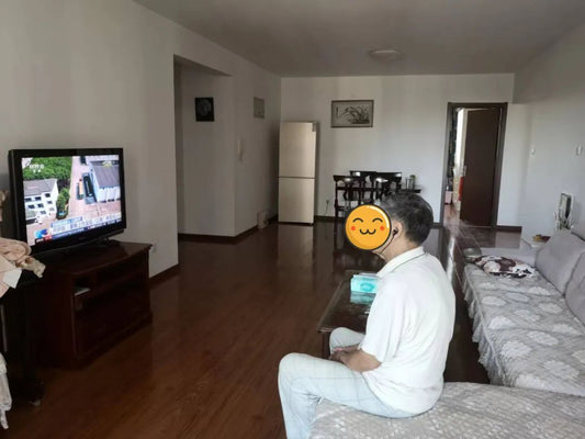 Mr Wen watching TV while wearing Incus Smart Personal Sound Amplifier