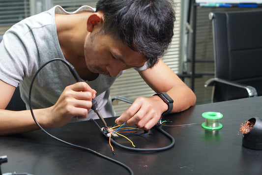 Engineer working on hearing aid prototype