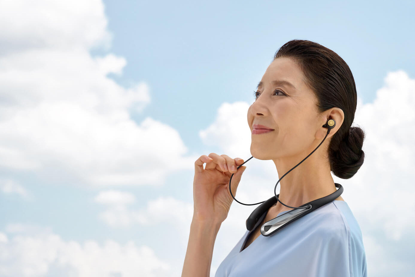 Woman wearing Kite 2 smart personal sound amplifier